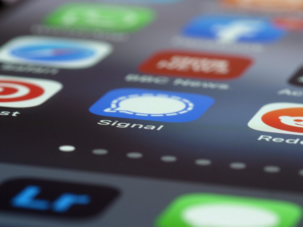 pexels-photo-8829444-8829444 Detailed view of various app icons on a smartphone screen highlighting Signal app.